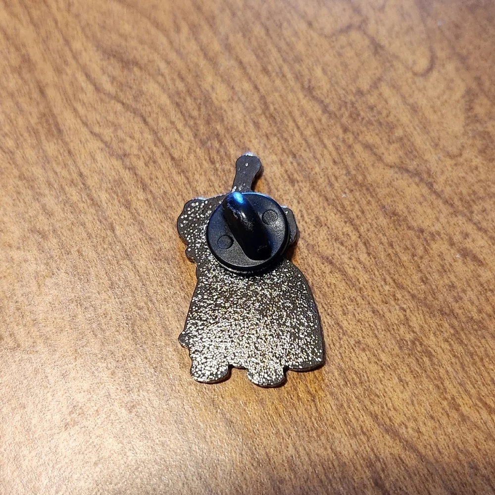 Nibbler enamel pin